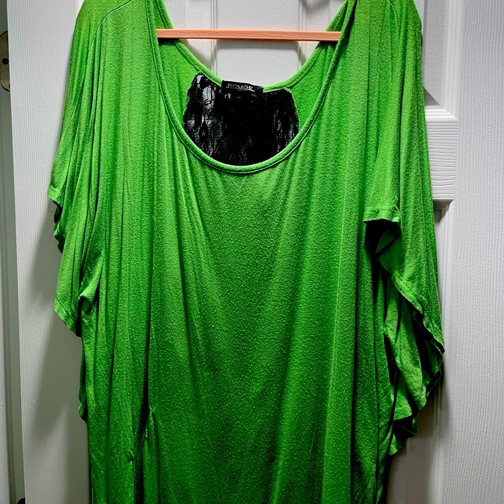 Green shirt with flowing arms and a black lace back